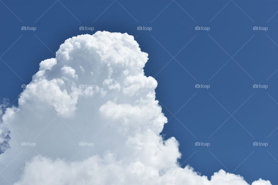 Pretty white fluffy clouds in the sky.