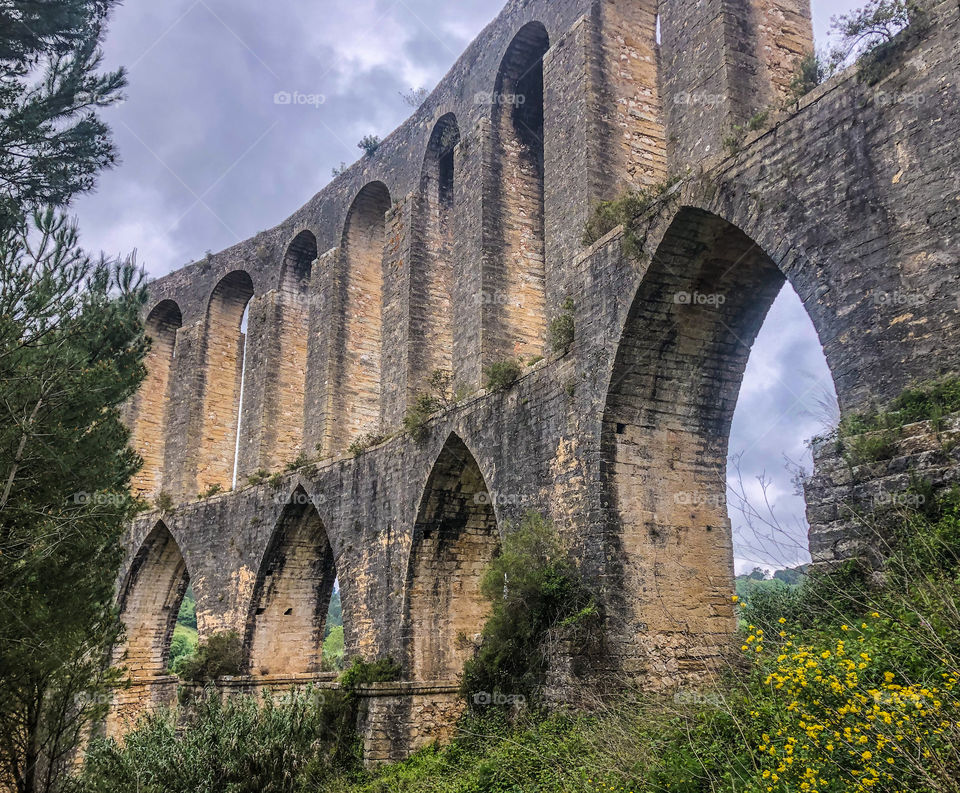 Double height archways forming part of the 6 kilometre aqueduct of the Convento de Cristo built 1593-1614, Tomar, Portugal 2021