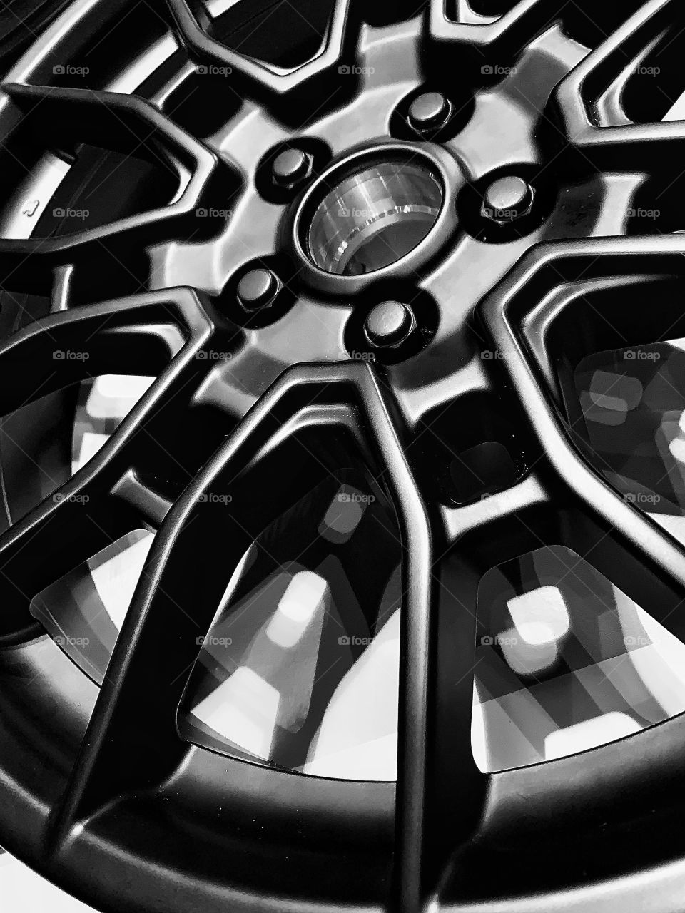 Black and white photo of a car wheel—taken in Chicago, Illinois 