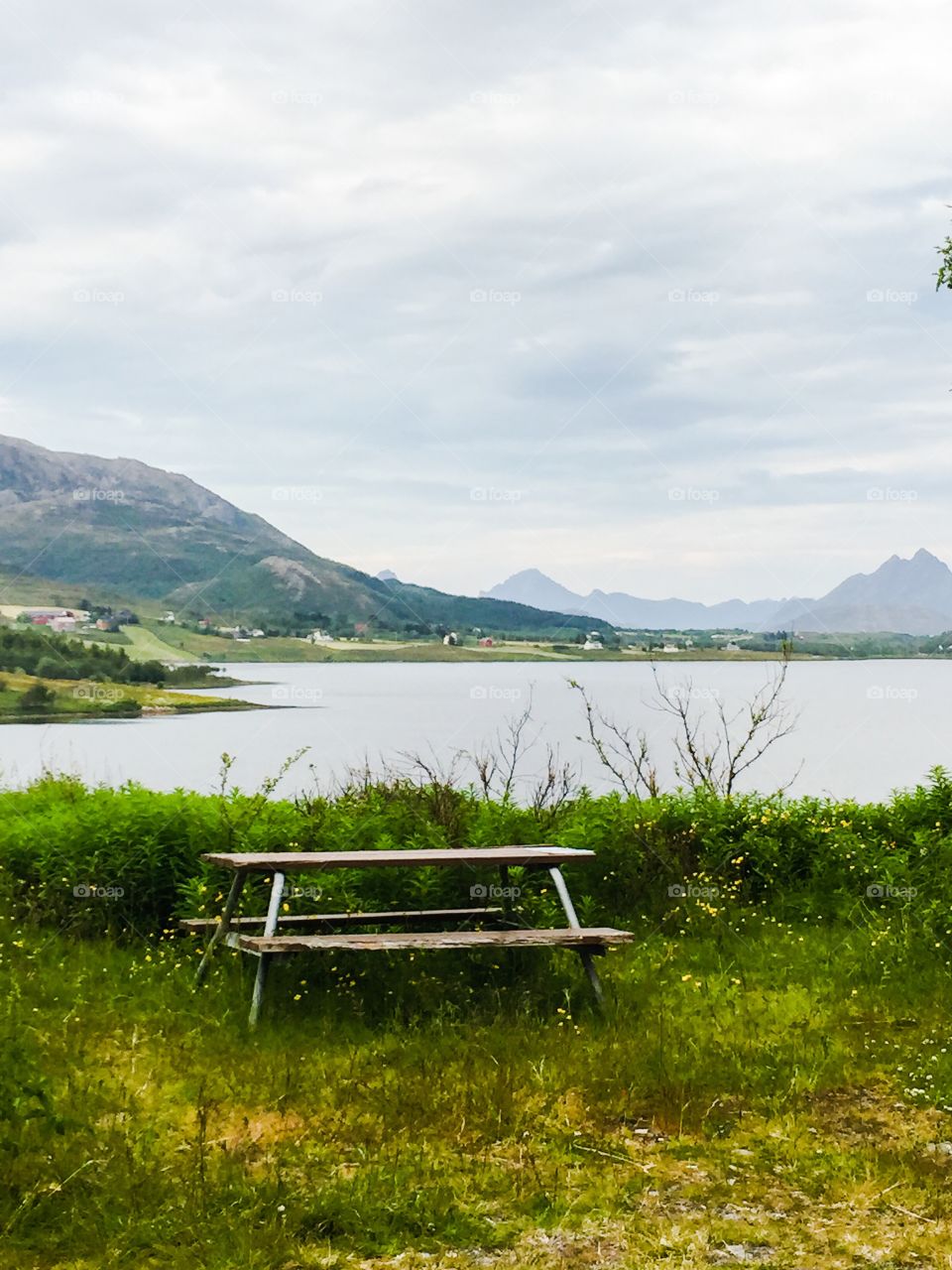 Empty picnic table near lake