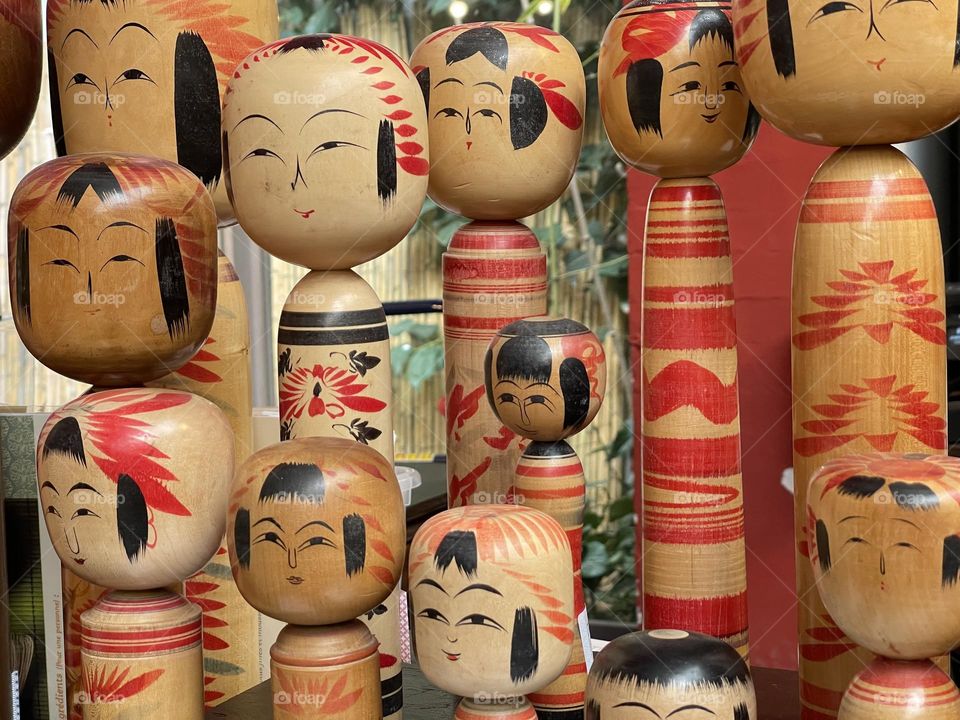 Assorted wood kokeshi dolls, engraved typical Japanese dolls, Japanese crafts, Japanese art and tradition 