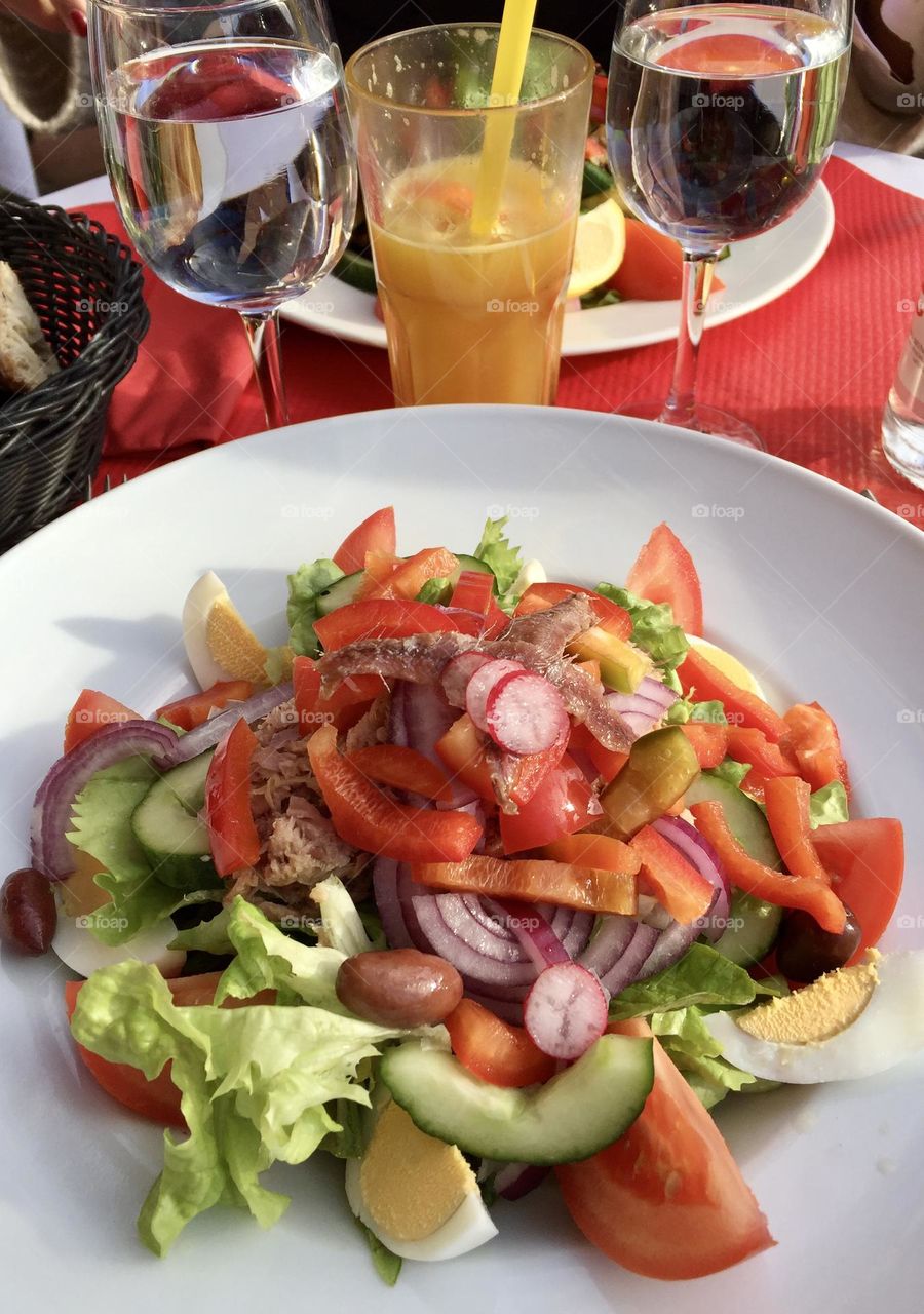 Fresh assorted salad with orange juice, healthy food, healthy meal 