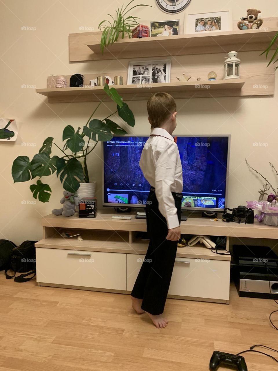 Redhead boy watching movie at home