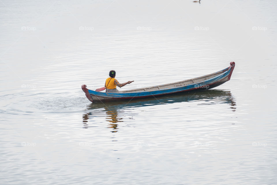 Local life style of fisherman in Early morning at Uben bridge , the longest wooden bridge in the world.