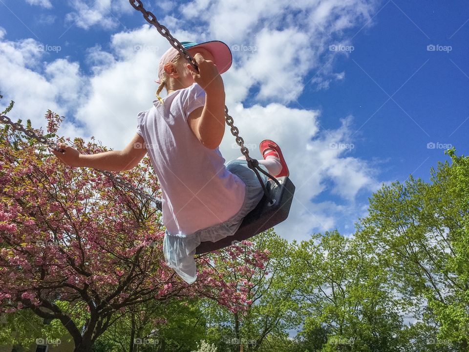 Girl sitting on swing