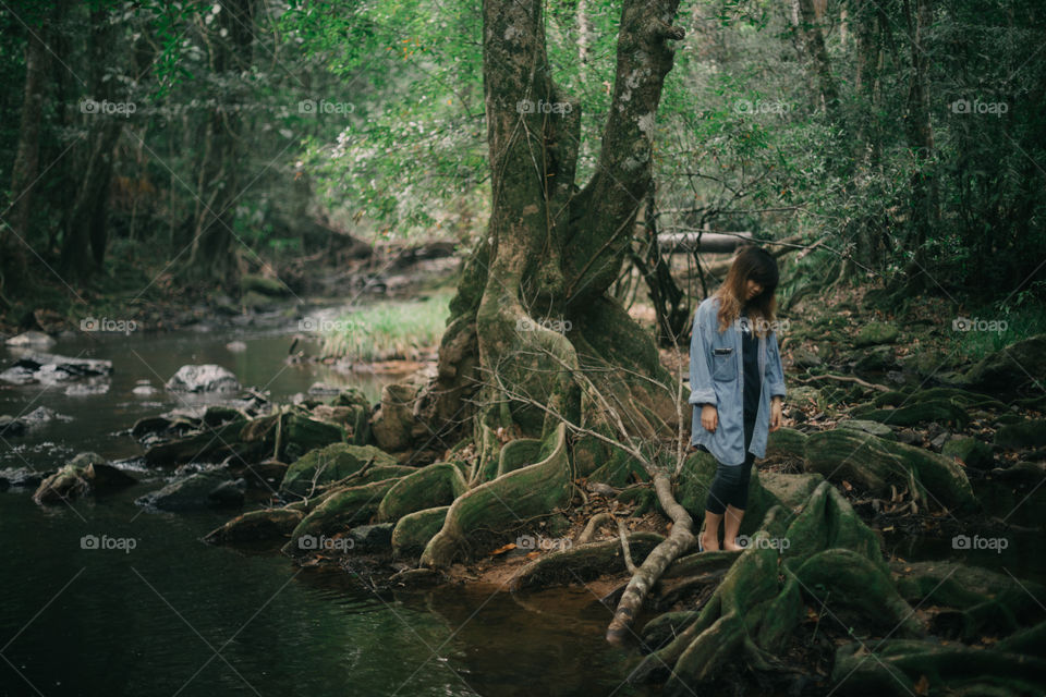 Girl in the forest pond