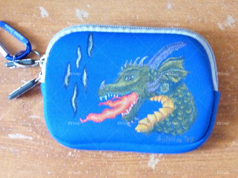 Dragon protecting the ipod.