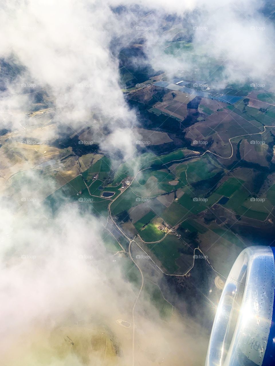 Arial shot of the Western Cape. Glorious mother nature. How beautiful are the clouds allowing you a peak at the fields below 