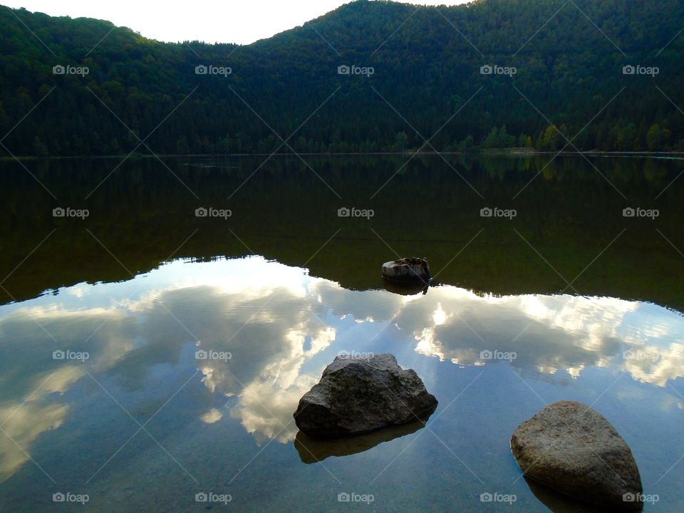 Reflection of blue sky and clouds in the water