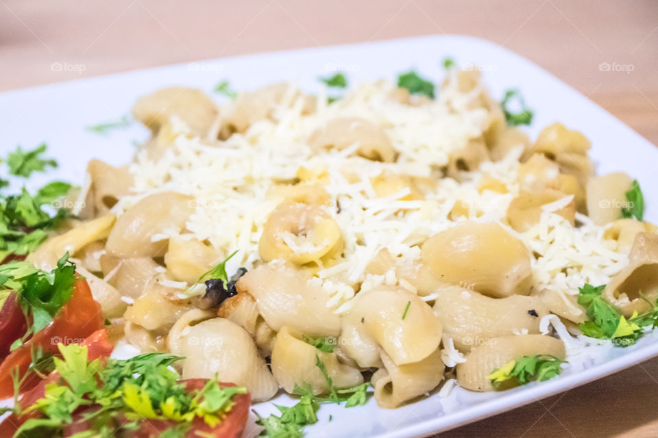 Pasta with cheese in plate