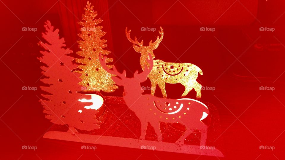 red christmas decorations with golden reindeer