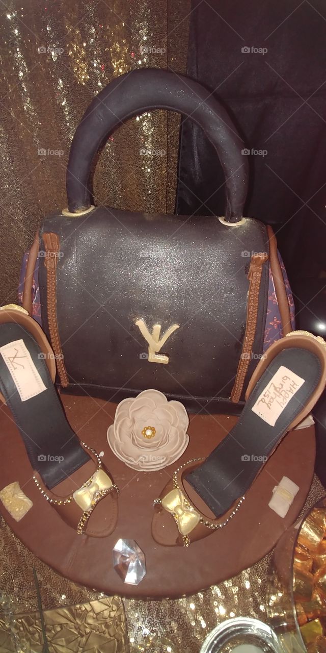 Louis Vuitton them birthday cake with guava filling and milk chocolate shoes.  Delicious and done with much talent.
