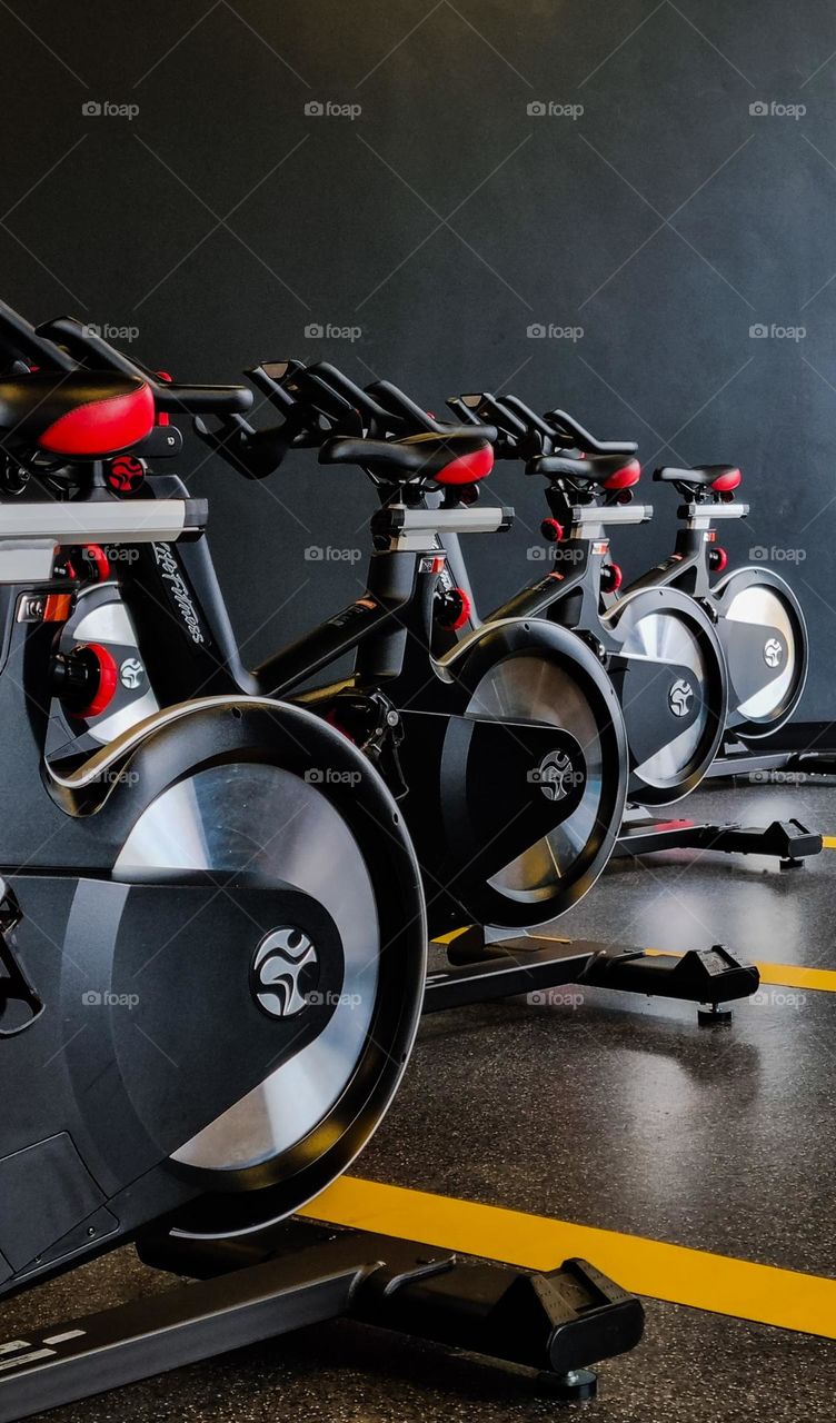 exercise bicycles in a gym studio.