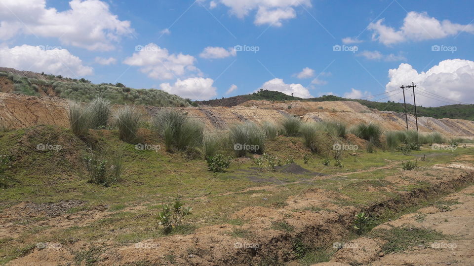 A beautiful scene of hills with his cloudy sky.