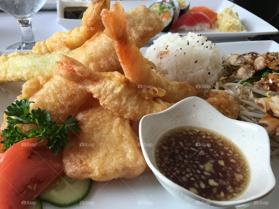 A beautiful meal of Japanese tempura prawns, teriyaki, sukiyaki, a wide array of healthy dishes 