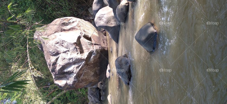 This big rock is in the middle of the river