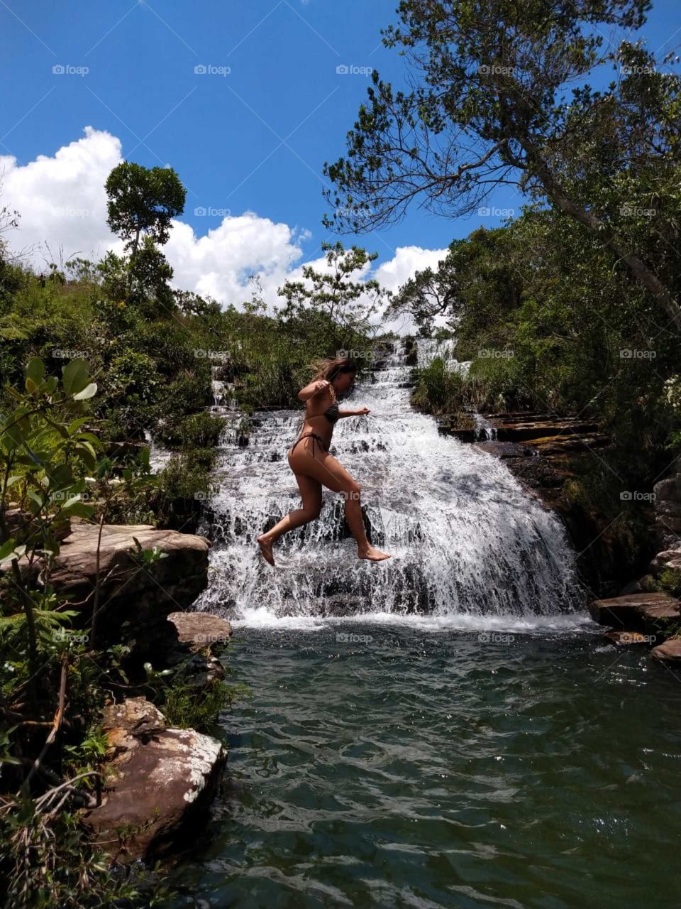 amazing waterfall.  woman in the  nature.  nature.  live to Life.  amazing jump.  amazing place.  paradise.