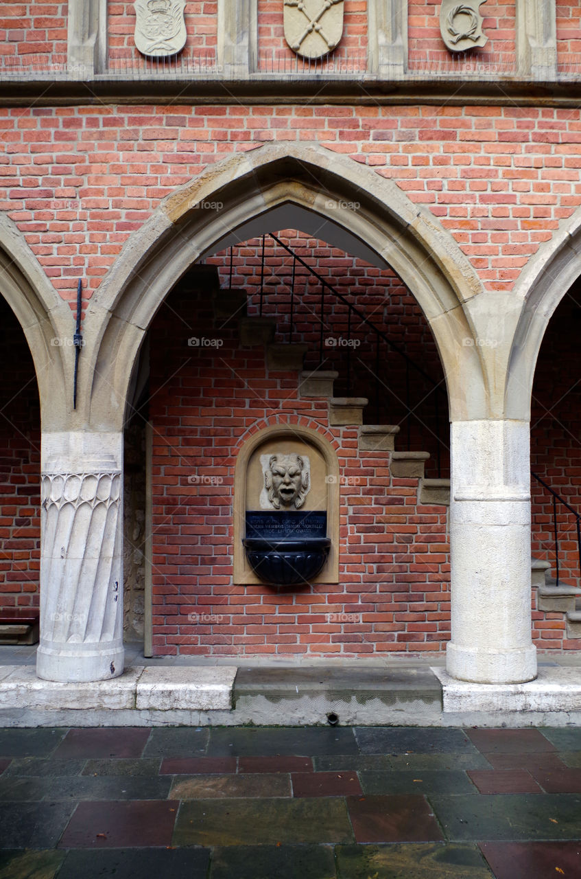 Arch inside the courtyard of the Collegium Maius in Kraków, Poland.