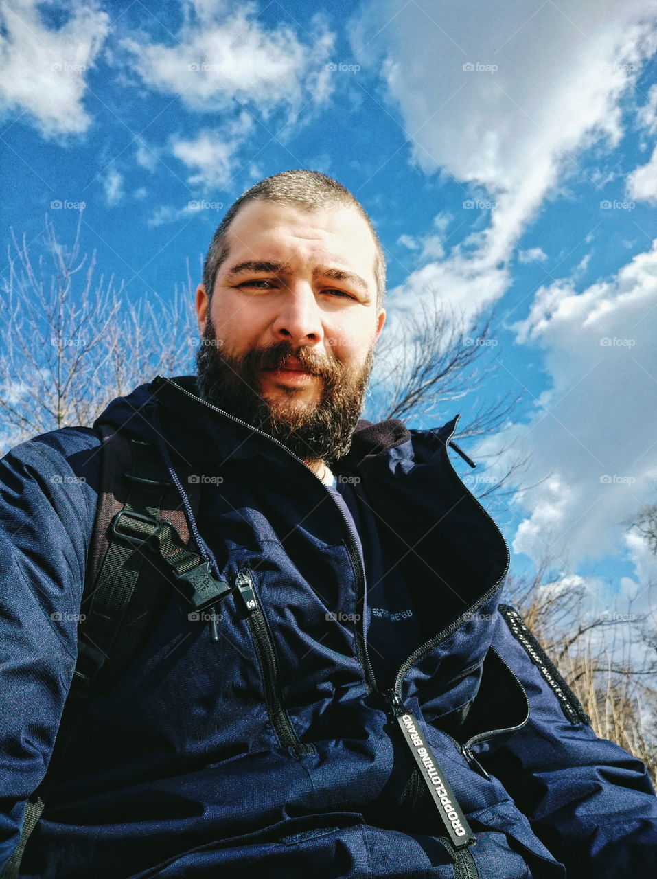 man with a beard against the sky