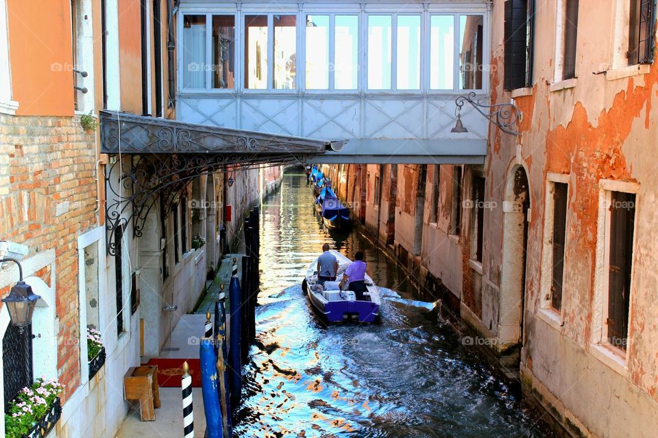 Venice water canal with s moving boat 