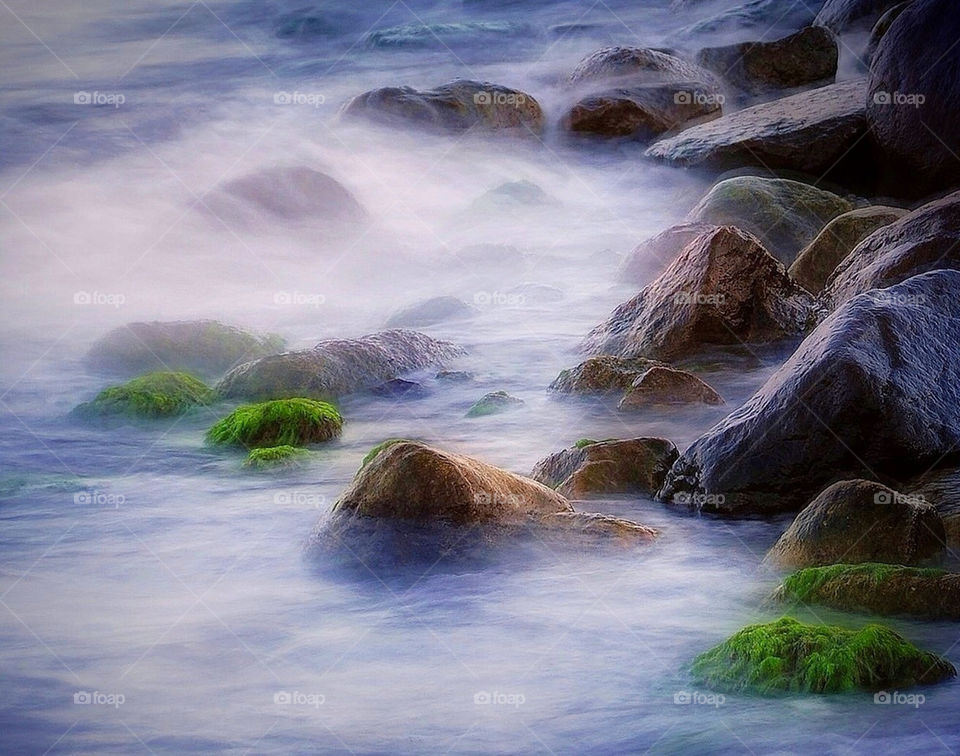 beach water stones sea by spidercam