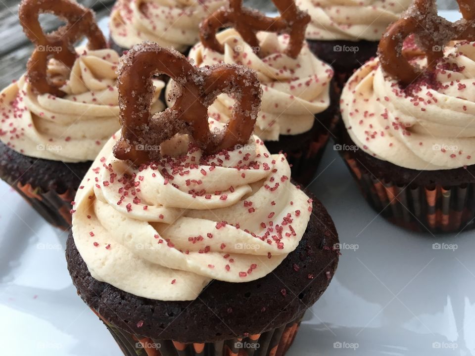 Milk Chocolate Cupcake with Caramel Buttercream with Cinnamon Sugar Pretzel 