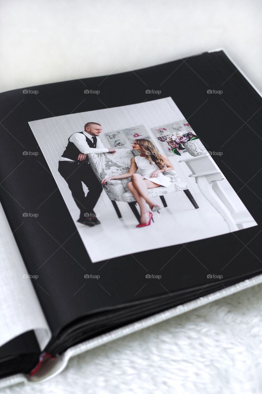 Photo of bride and groom in photo album 