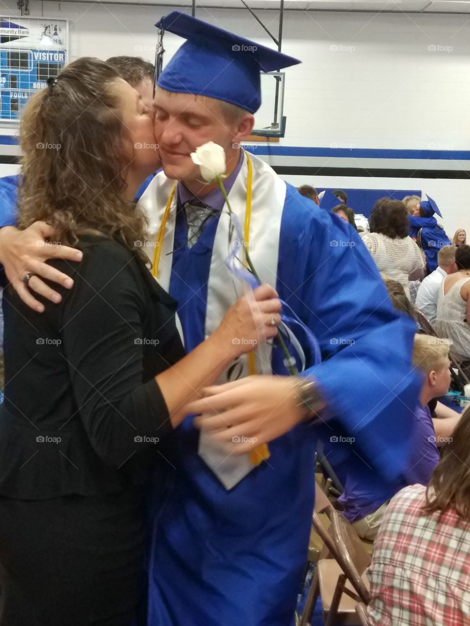 boy with mom at graduation