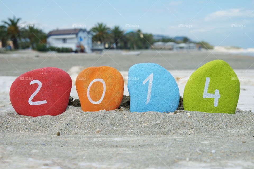 2014, Happy New Year on colourful stones