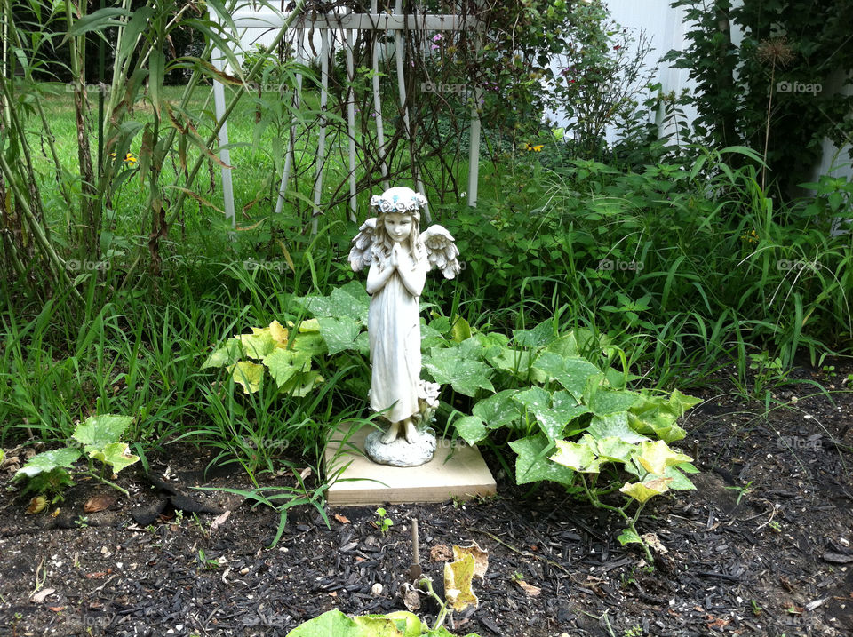 garden statue angel by pilsner