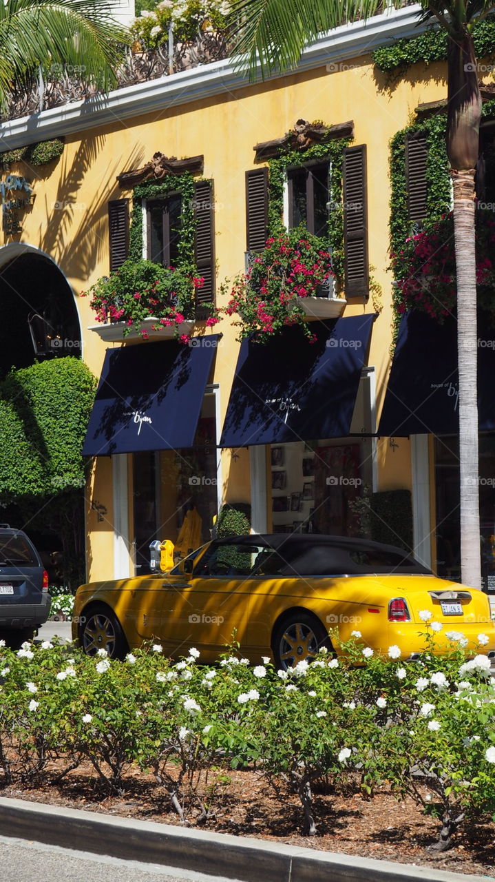 Yellow rolls royce 1 of 1 car. Luxury rolls royce car one of one made rodeo drive Los Angeles Beverly Hills California