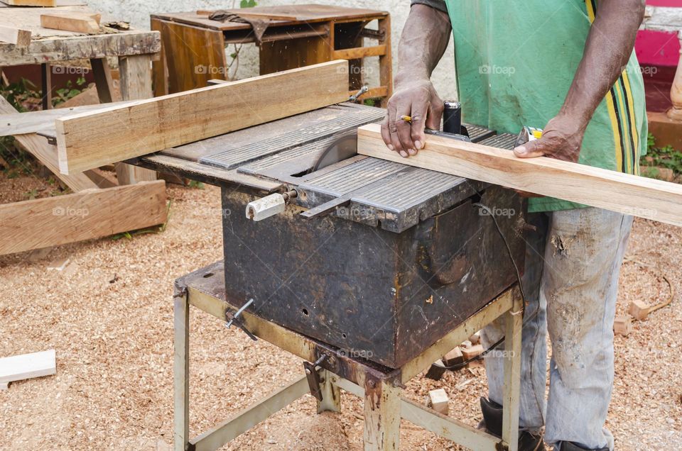 Man Using Electric Saw