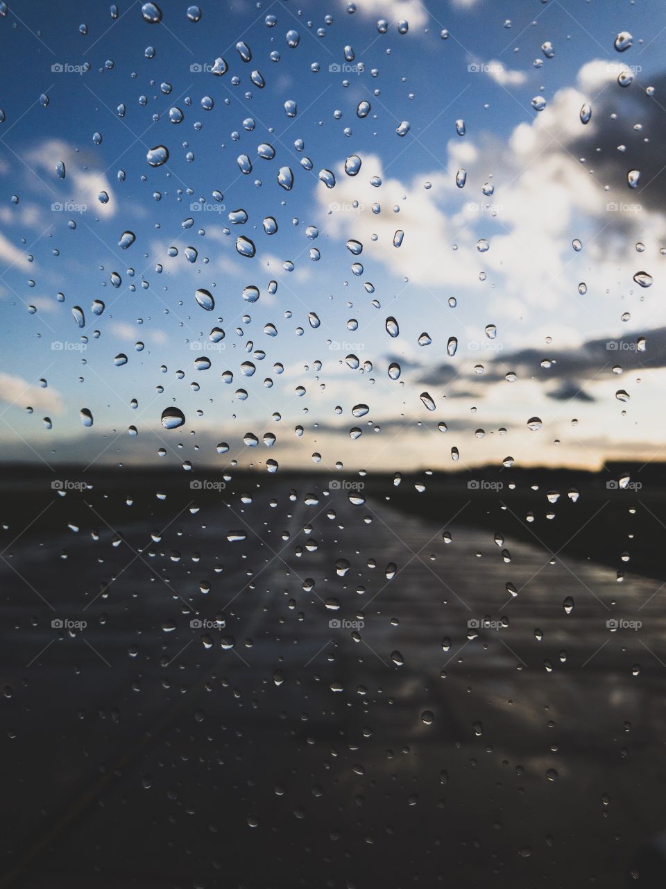Water droplets on plane window