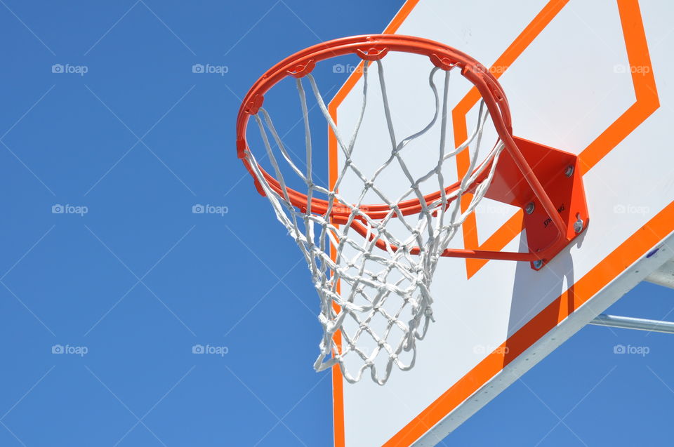 Close up of an outdoor basketball hoop.