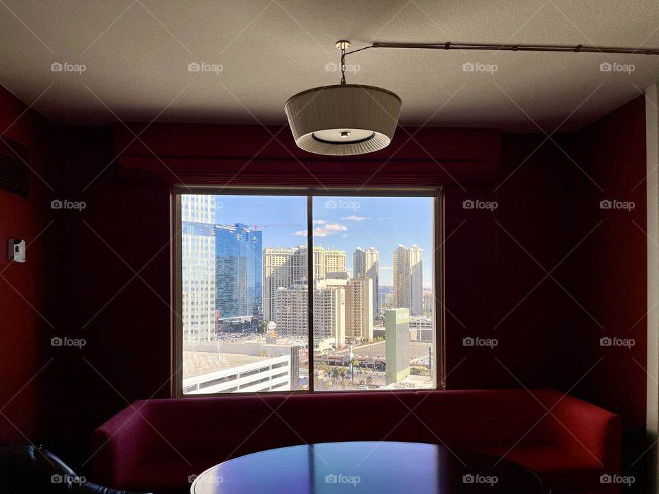 Room with window and cityscape 