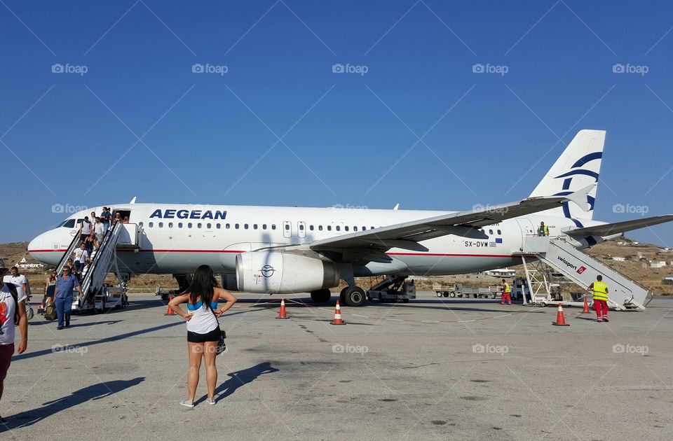 Aegean Airlines Airbus A320. Landing at Mykonos island  JMK airport at Cyclades Greece after flying over  the Aegean sea with a Star Alliance member