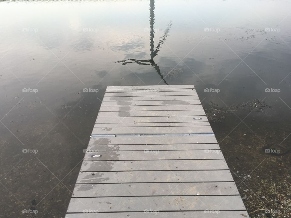 windmill reflecting in the water