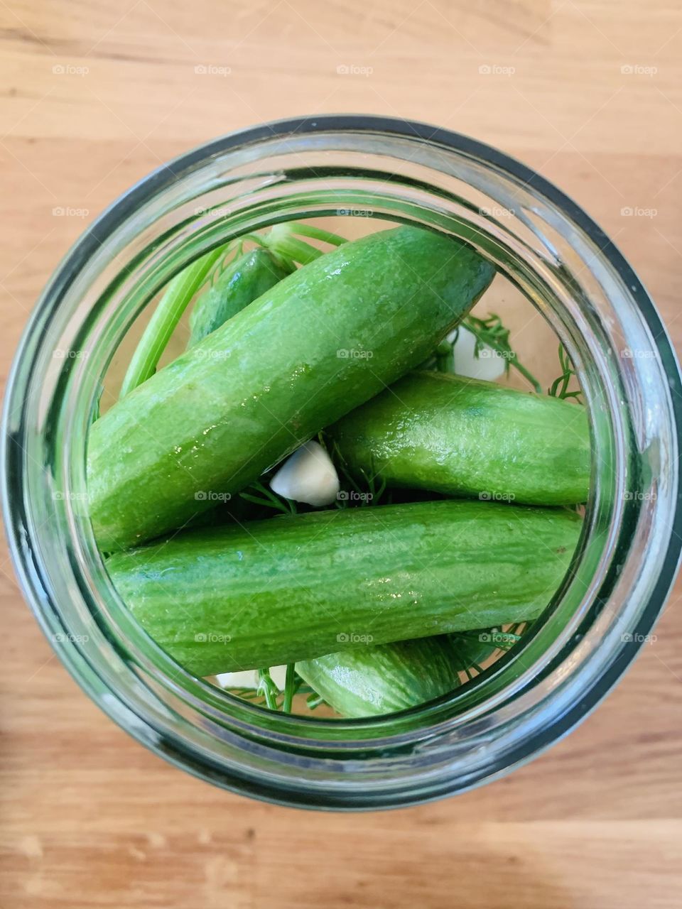 Upper view of a jar with cucumbers pickles 