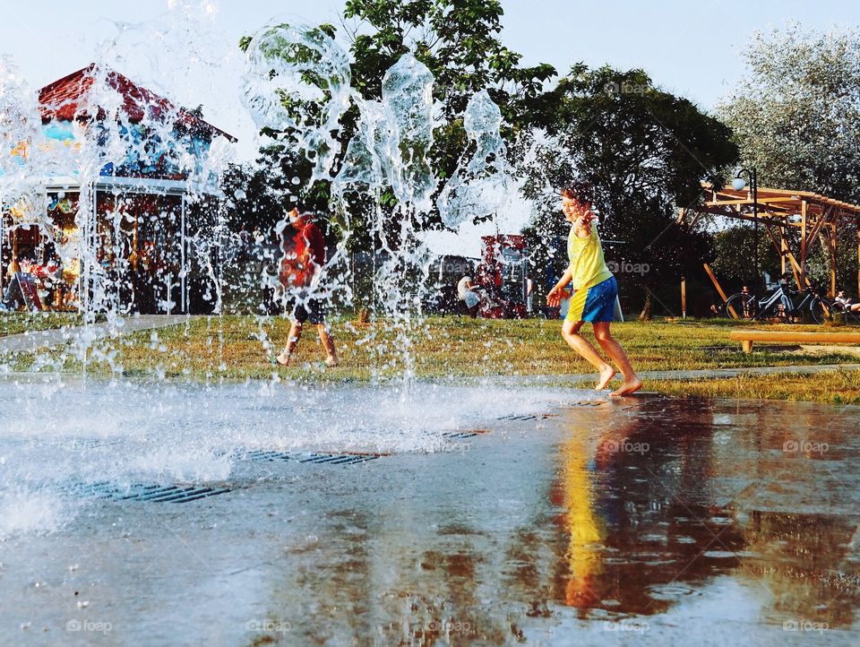 Euphoria.... A kid running through water splashes...