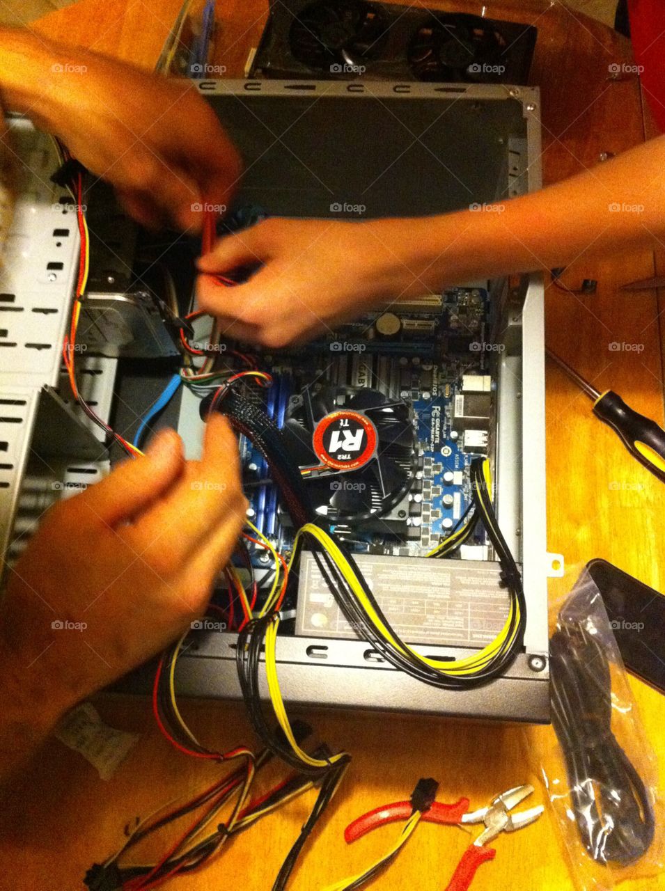 Dad teaching son how to build a custom PC
