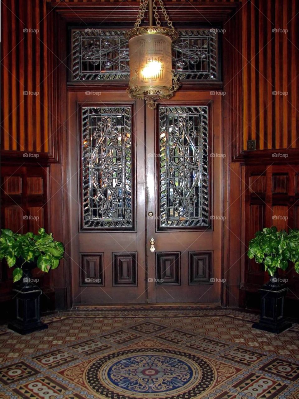 Ornate wooden door with leaded glass