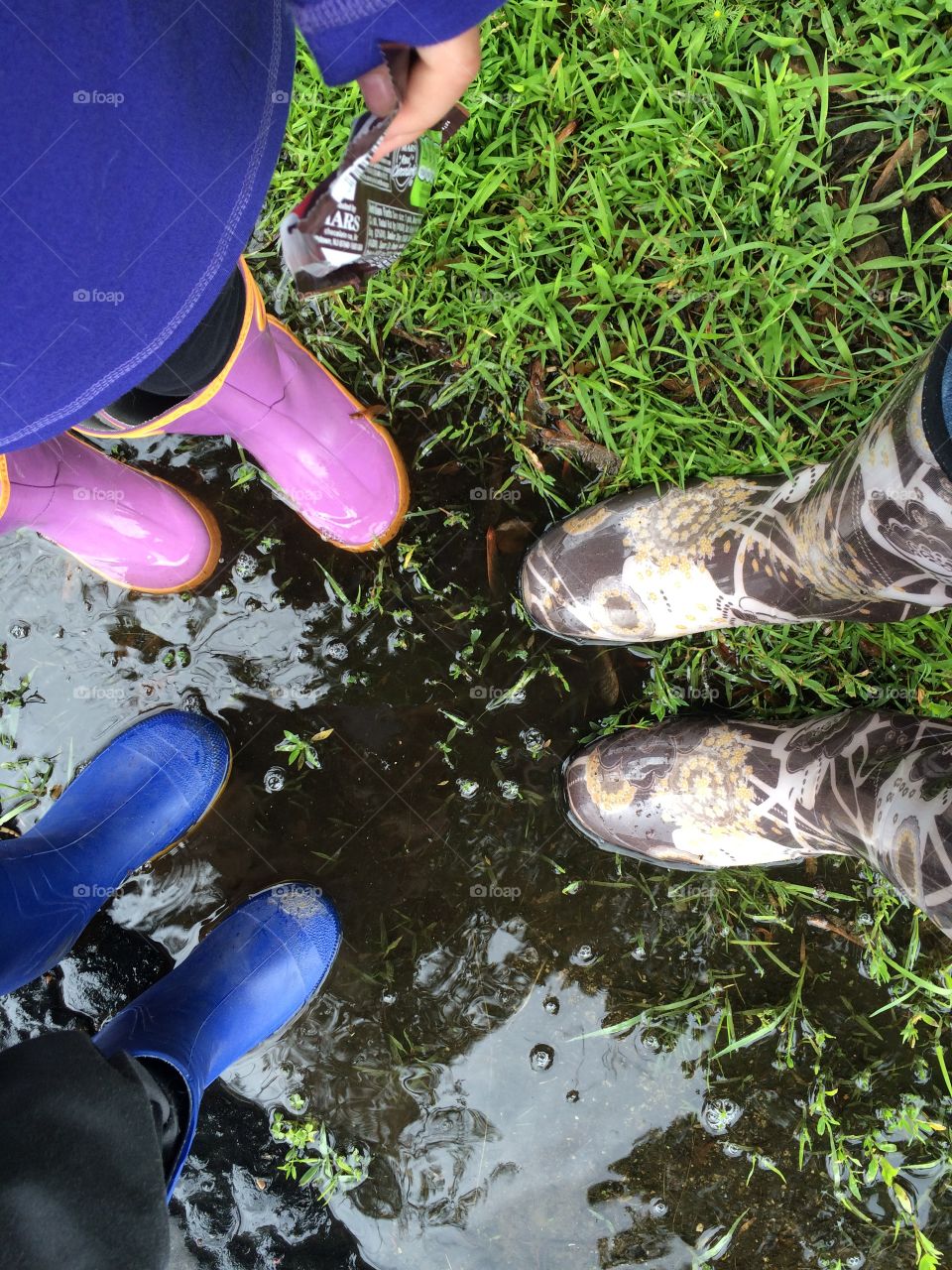 Rain puddle and boots 