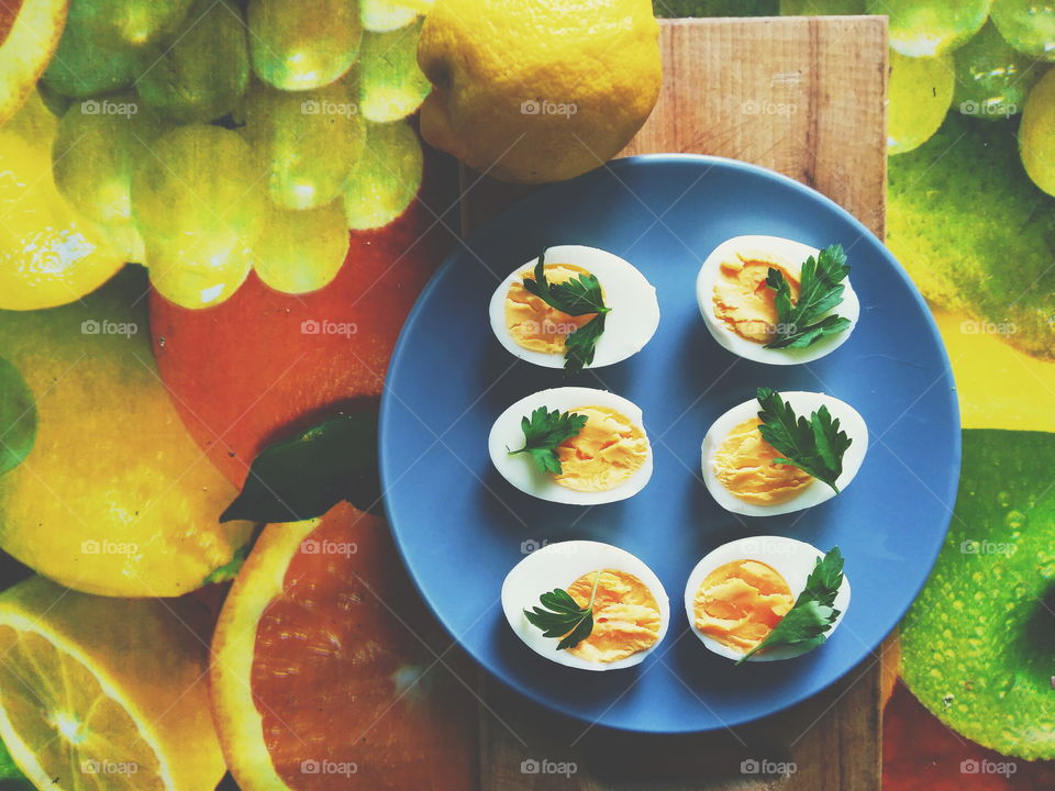 cut boiled eggs decorated with parsley