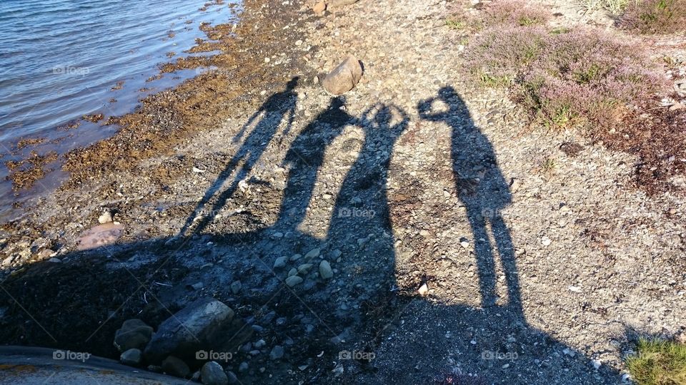 People in group shadows