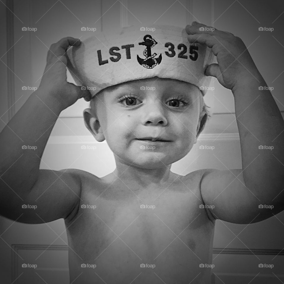 Portrait of a boy wearing sailor cap