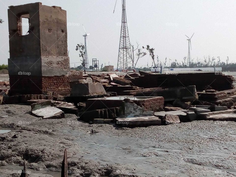 This is a sea beach with broken stalls for aamphan in West Bengal