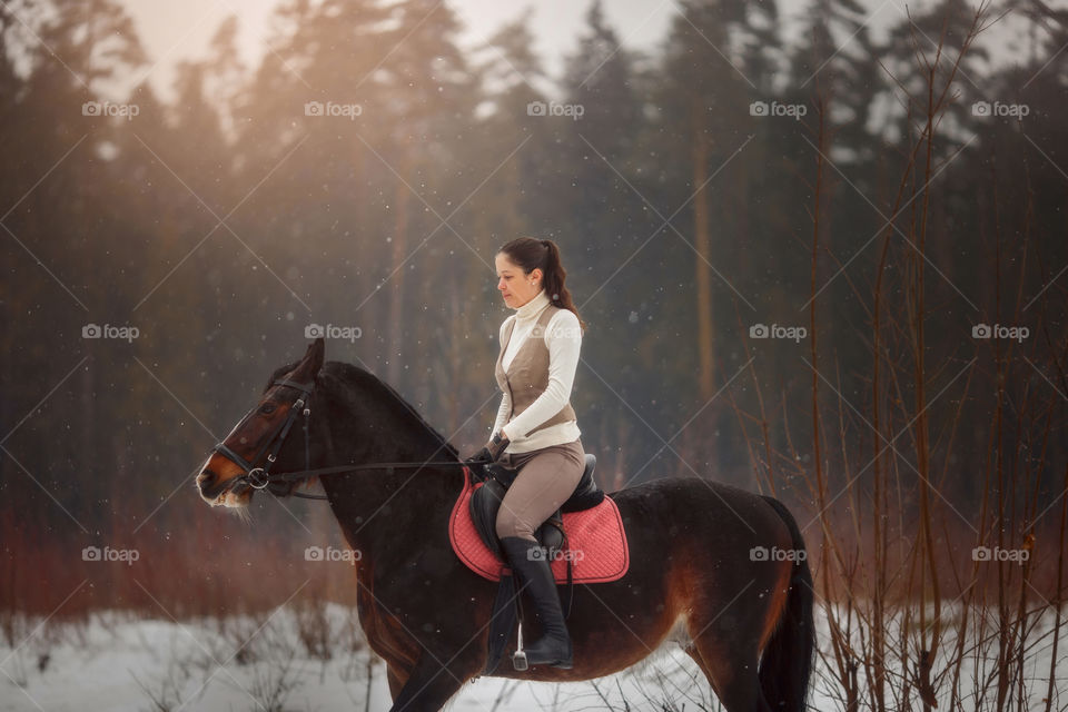 Young beautiful woman with horse outdoor portrait at spring day