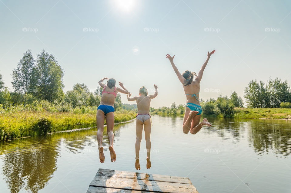 Jumping in the water, kids have fun