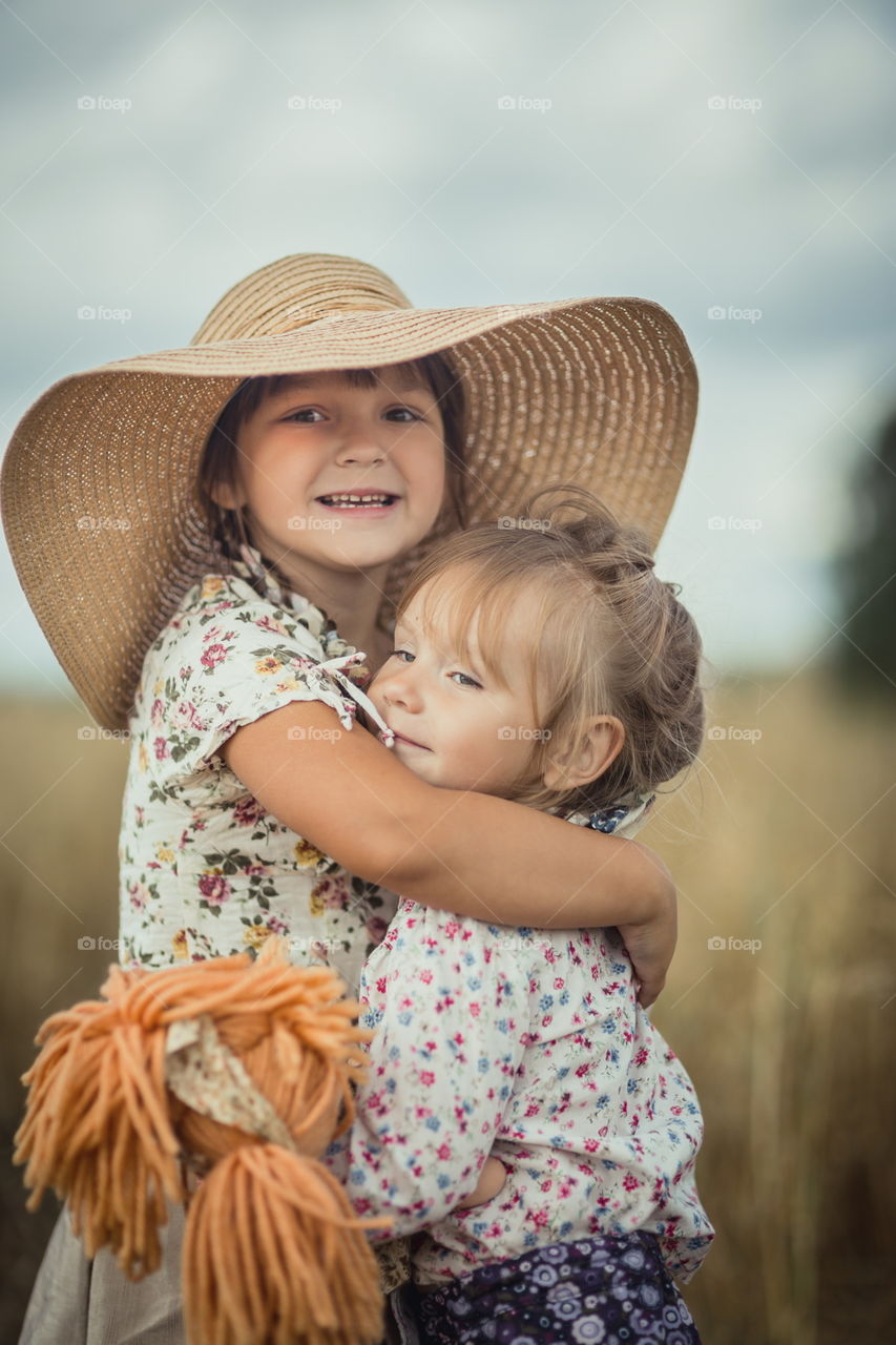 Little sisters in park