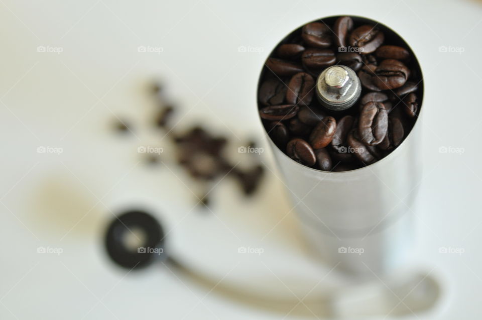 Preparing coffee in coffee grinder